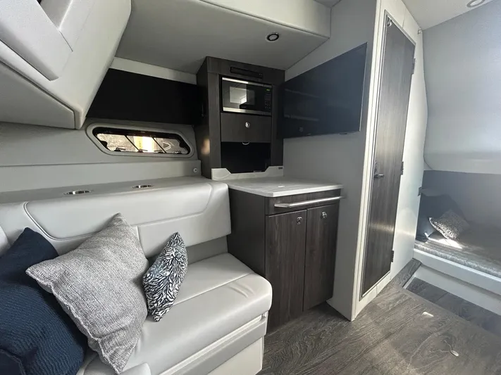  Yacht Photos Pics 2020 Formula 380 Super Sport Crossover interior with modern seating and cabinetry.