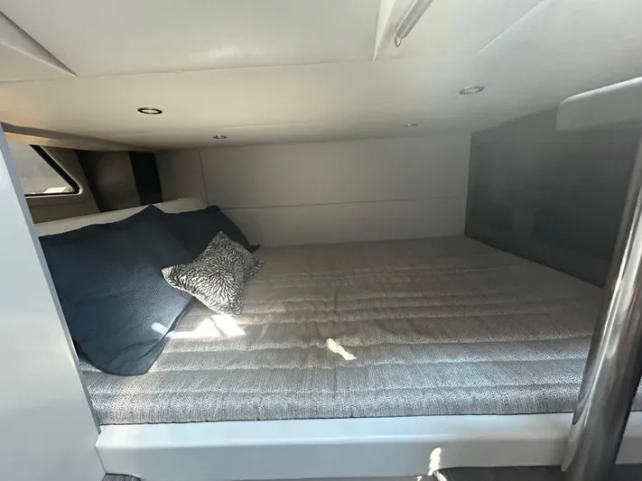  Yacht Photos Pics Cozy cabin interior of 2020 Formula 380 Super Sport Crossover with plush bedding.