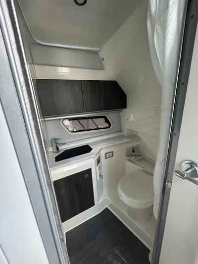  Yacht Photos Pics 2020 Formula 380 Super Sport Crossover bathroom interior with modern fixtures and cabinetry.