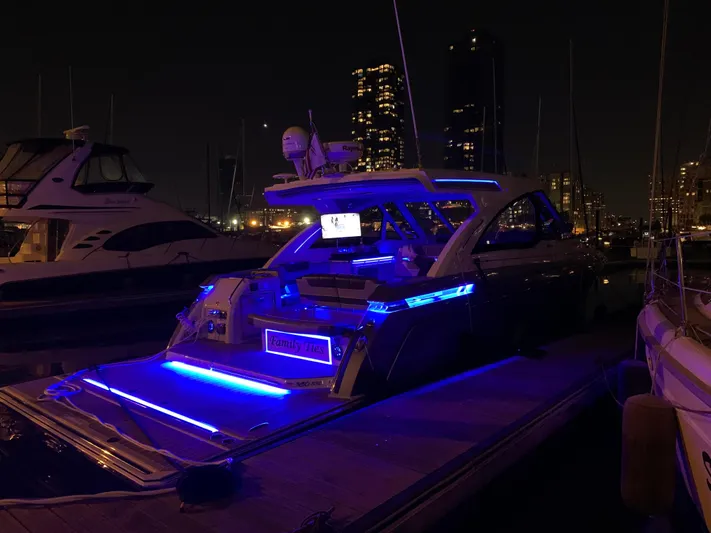  Yacht Photos Pics 2020 Formula 380 Super Sport Crossover yacht with blue LED lights at night.