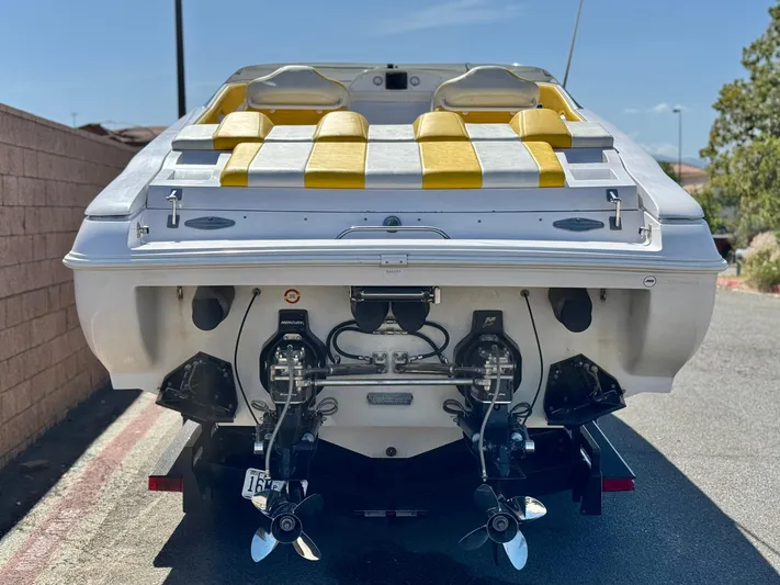  Yacht Photos Pics 2004 Donzi 38 ZX boat with yellow seating, rear view showing dual propellers.