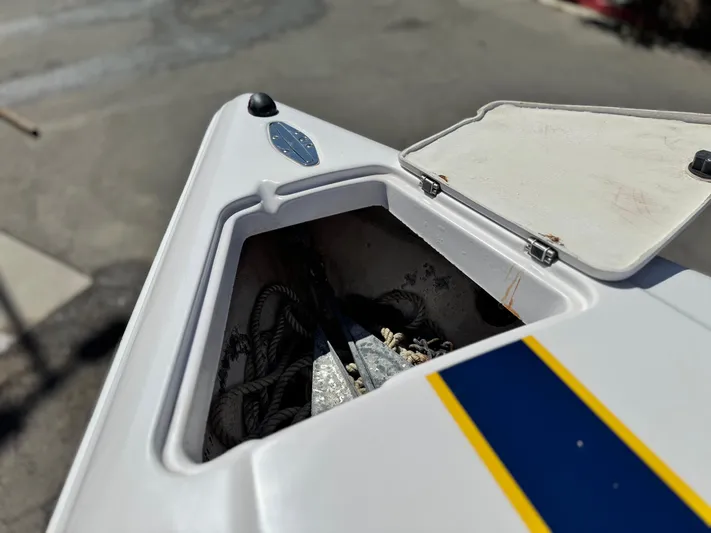  Yacht Photos Pics Open storage compartment on 2004 Donzi 38 ZX boat, featuring ropes and anchor.