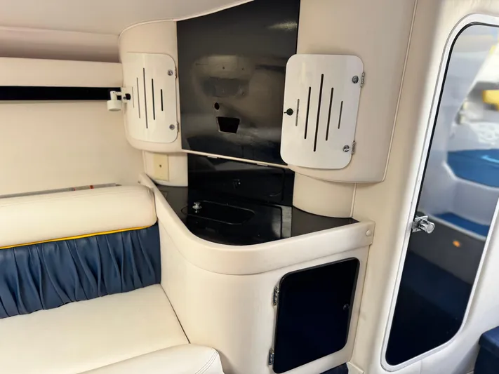  Yacht Photos Pics Interior of a 2004 Donzi 38 ZX boat, featuring sleek cabinetry and seating.