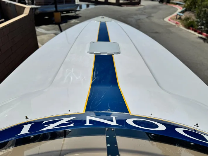  Yacht Photos Pics 2004 Donzi 38 ZX boat with blue and yellow stripe on deck.