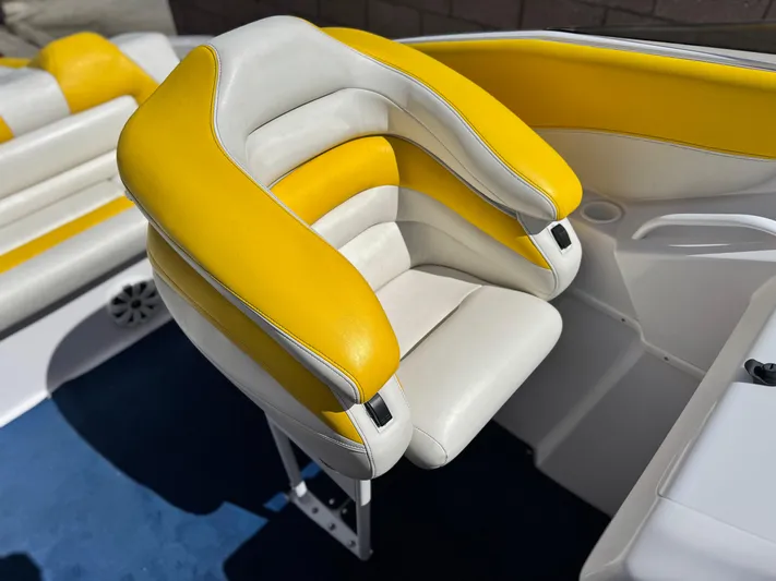  Yacht Photos Pics 2004 Donzi 38 ZX boat seat with yellow and white upholstery, showcasing sleek design.