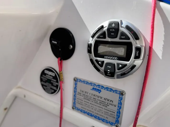  Yacht Photos Pics 2004 Donzi 38 ZX yacht dashboard with Kenwood audio controls and certification plaque.