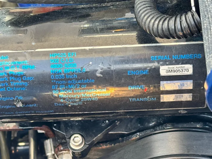  Yacht Photos Pics 2004 Donzi 38 ZX engine specifications and serial number details on a black surface.