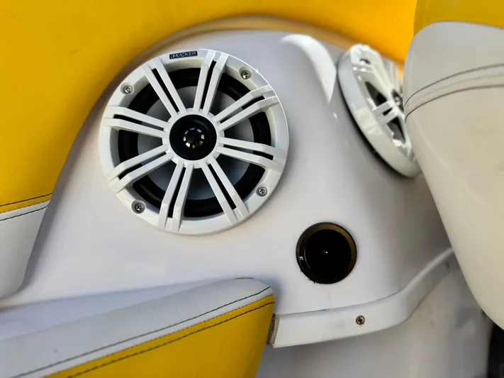  Yacht Photos Pics 2004 Donzi 38 ZX boat interior with yellow upholstery and marine speakers.