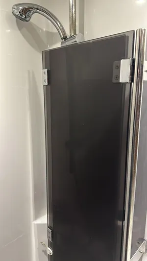  Yacht Photos Pics Shower area in 2013 Beneteau Oceanis 50 yacht with sleek black panel.