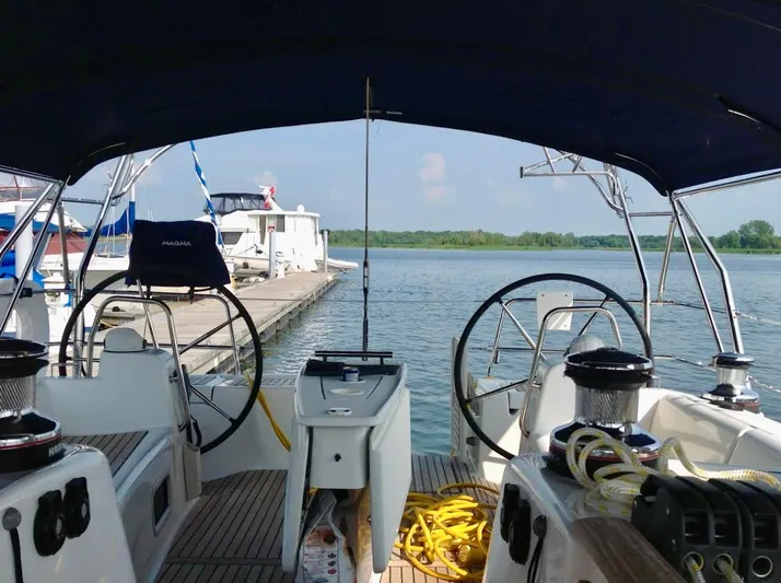 Yacht Photos Pics Beneteau Oceanis 50 sailboat cockpit view, docked at marina, 2013 model.
