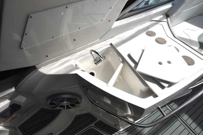 Dauntless Yacht Photos Pics 2017 Monterey 355 Sport Yacht sink area with storage and cup holders.