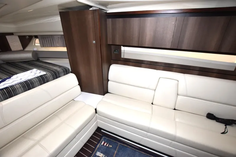 Dauntless Yacht Photos Pics Luxurious interior of 2017 Monterey 355 Sport Yacht with white leather seating and wood accents.