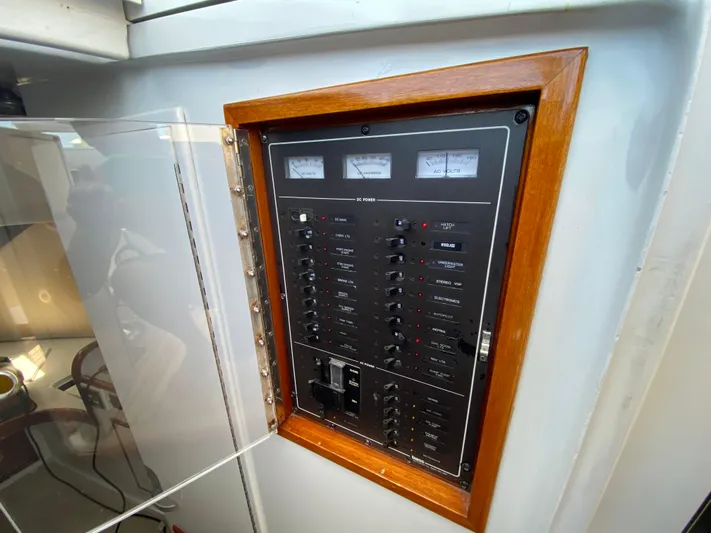  Yacht Photos Pics Electrical panel on a 1995 L&H 33 boat, featuring switches and gauges.