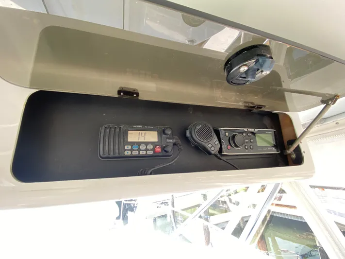  Yacht Photos Pics Storage compartment with communication devices on a 1995 L&H 33 boat.