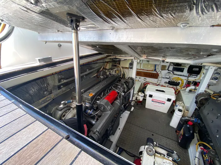  Yacht Photos Pics Engine room of a 1995 L&H 33 boat, showcasing mechanical components and equipment.