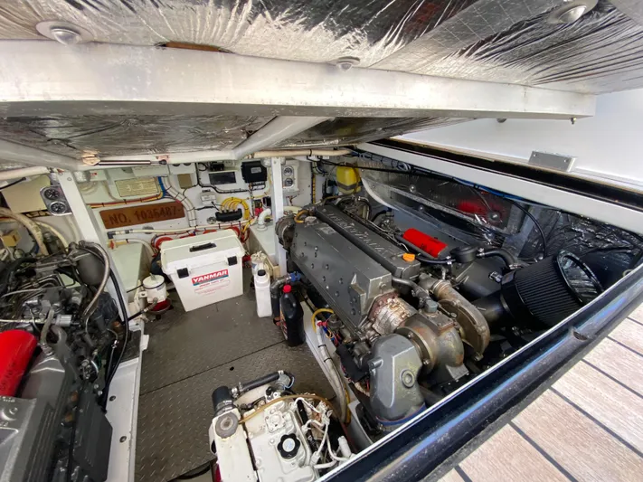  Yacht Photos Pics Engine room of a 1995 L&H 33 boat, showcasing mechanical components and equipment.