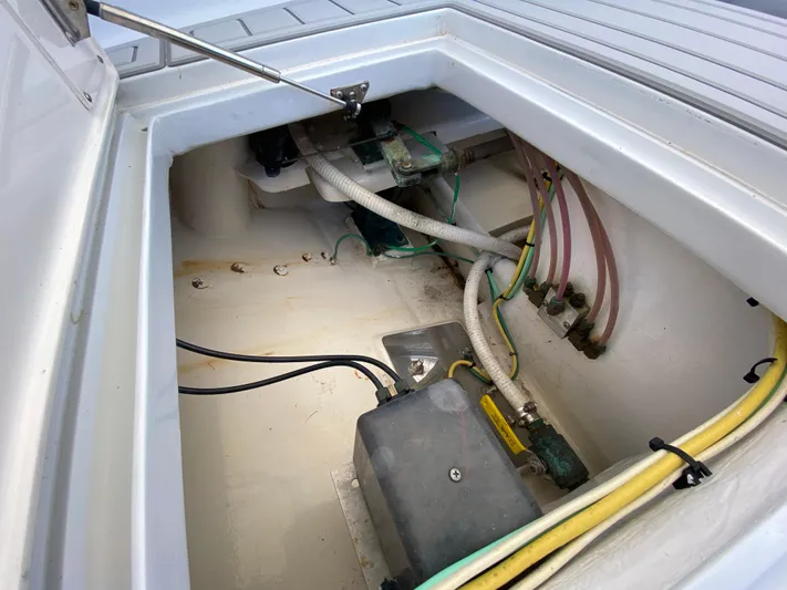  Yacht Photos Pics Open compartment of 1995 L&H 33 boat showing wiring and hoses.