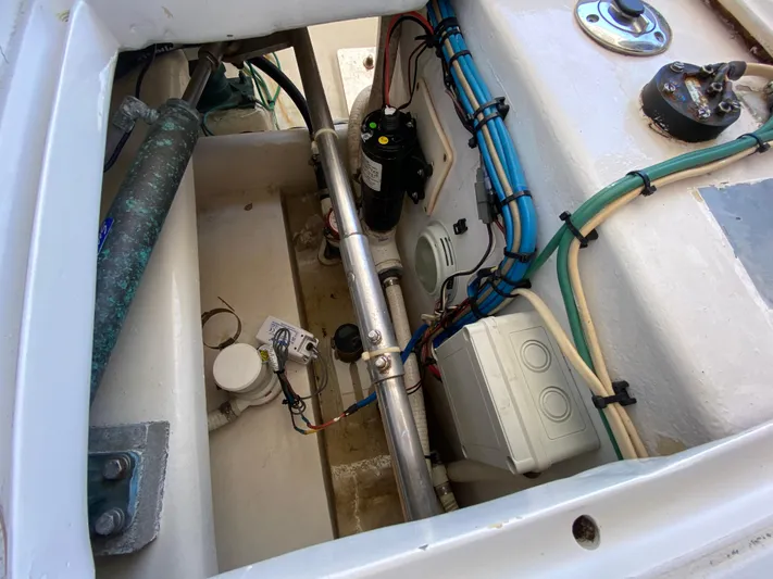  Yacht Photos Pics Engine compartment of a 1995 L&H 33 boat, showcasing wiring and mechanical components.