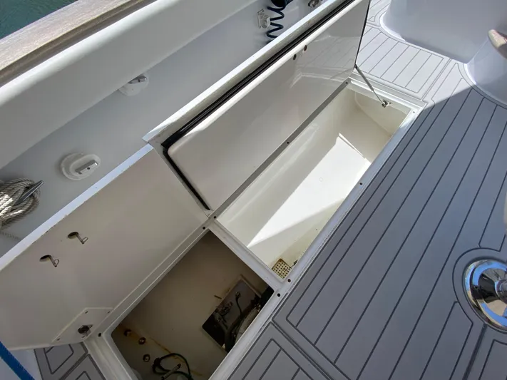  Yacht Photos Pics Open storage compartments on a 1995 L&H 33 boat deck.