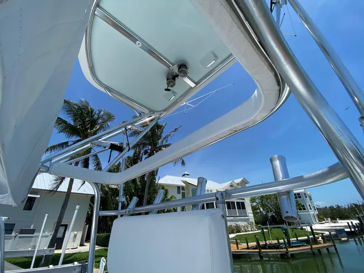  Yacht Photos Pics View from a 1995 L&H 33 boat, showcasing the canopy and marina backdrop.