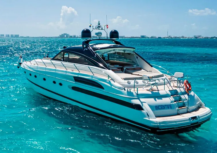 2004 Princess 65 @ Cancun Incentive Yacht Photos Pics Luxury 2004 Princess 65 yacht cruising on clear turquoise waters.