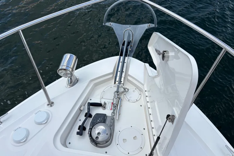  Yacht Photos Pics 2016 Sea Ray 350 Sundancer anchor system on deck, with water in the background.