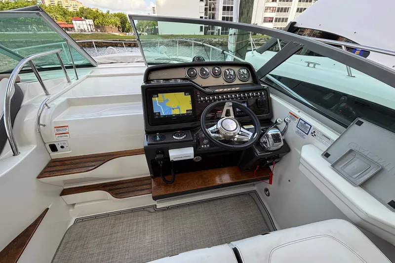  Yacht Photos Pics Cockpit of 2016 Sea Ray 350 Sundancer with navigation system and steering wheel.