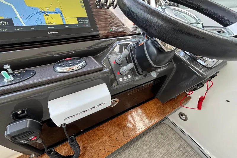  Yacht Photos Pics Helm of 2016 Sea Ray 350 Sundancer with Garmin navigation and Standard Horizon equipment.