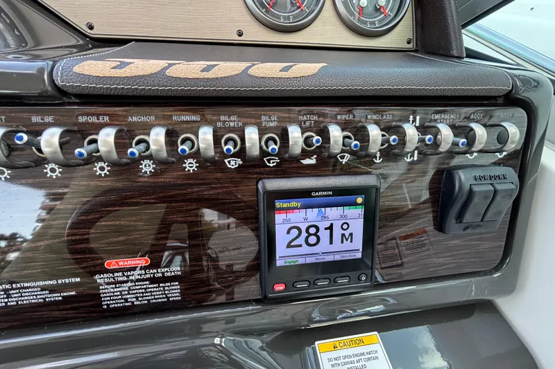  Yacht Photos Pics Control panel of 2016 Sea Ray 350 Sundancer with switches and Garmin display.