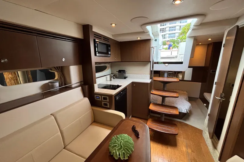  Yacht Photos Pics Interior of 2016 Sea Ray 350 Sundancer yacht with modern kitchen and seating area.