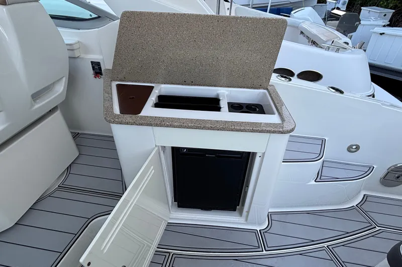  Yacht Photos Pics 2016 Sea Ray 350 Sundancer boat kitchenette with sink and mini fridge.