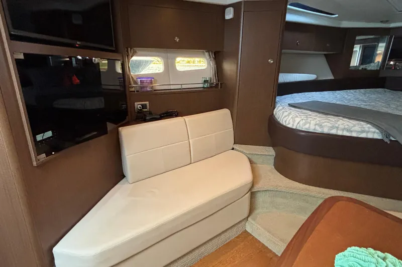  Yacht Photos Pics Interior of 2016 Sea Ray 350 Sundancer yacht with seating and bed area.