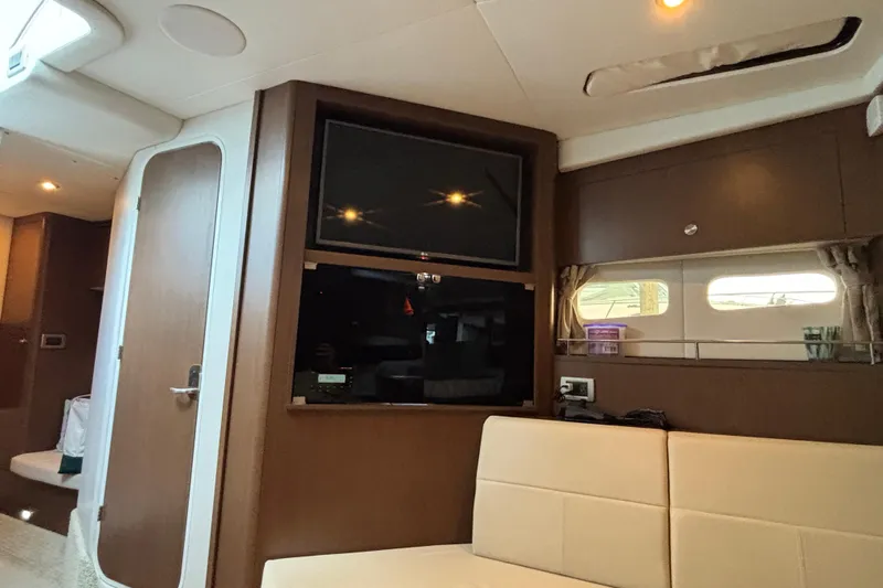  Yacht Photos Pics Interior of 2016 Sea Ray 350 Sundancer yacht with TV and seating area.