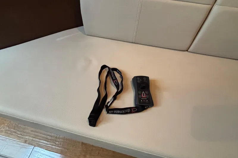  Yacht Photos Pics Remote control with lanyard on a Sea Ray 350 Sundancer 2016 boat seat.