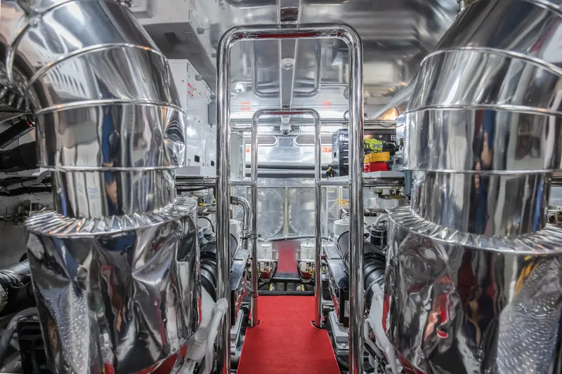 Bad Daddy Yacht Photos Pics Engine room of a 2005 Horizon 94 Motoryacht with polished metal components.
