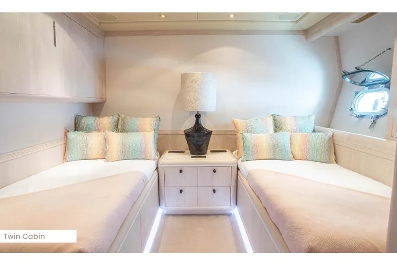  Yacht Photos Pics Luxurious twin cabin on 2004 Mangusta 130 yacht with elegant decor and soft lighting.