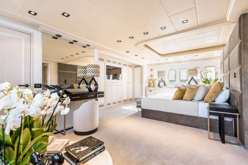  Yacht Photos Pics Luxurious 2004 Mangusta 130 yacht interior with elegant bedroom decor and modern furnishings.