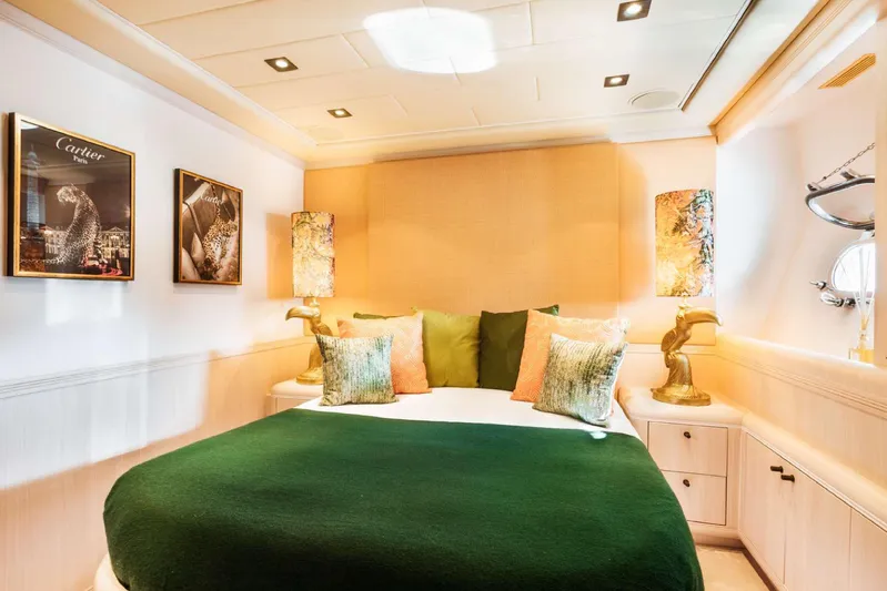  Yacht Photos Pics Luxurious 2004 Mangusta 130 yacht bedroom with elegant decor and stylish lighting.