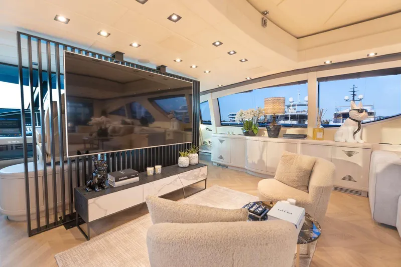  Yacht Photos Pics Luxurious 2004 Mangusta 130 yacht interior with modern decor and large windows.