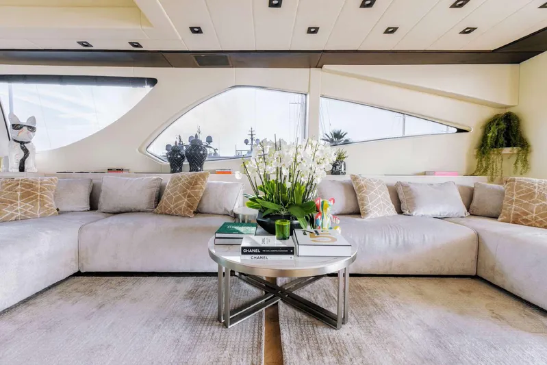  Yacht Photos Pics Luxurious interior of 2004 Mangusta 130 yacht with elegant decor and plush seating.