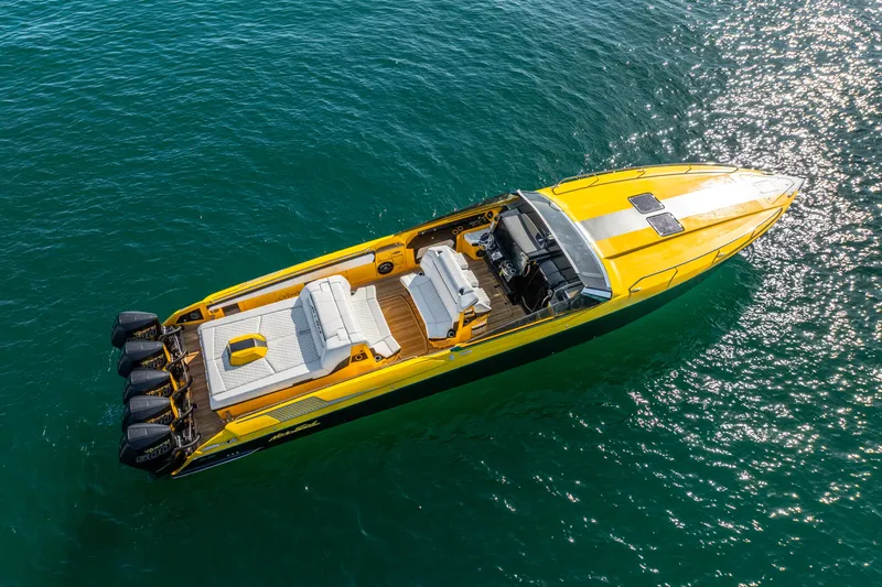 Purley Pleasure Yacht Photos Pics Yellow 2021 Nor-Tech 460 Flyer boat on clear blue water, aerial view.