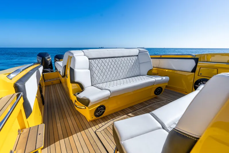 Purley Pleasure Yacht Photos Pics 2021 Nor-Tech 460 Flyer boat interior with yellow accents and ocean view.