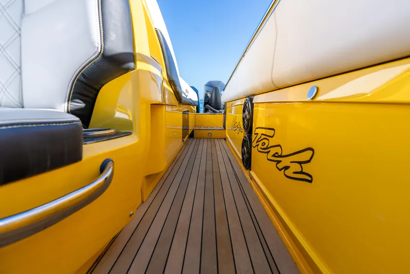 Purley Pleasure Yacht Photos Pics Yellow 2021 Nor-Tech 460 Flyer boat interior with teak flooring and sleek design.