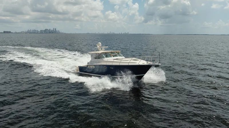  Yacht Photos Pics 1998 Tiara Yachts 4300 Open cruising on open water under cloudy skies.