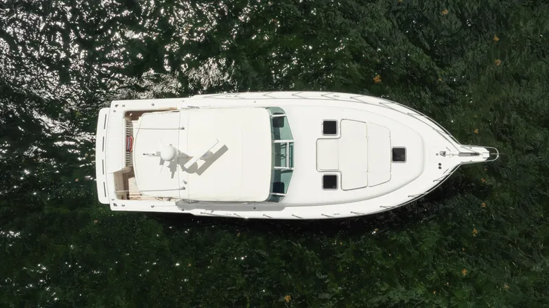  Yacht Photos Pics Overhead view of a 1998 Tiara Yachts 4300 Open on shimmering water.