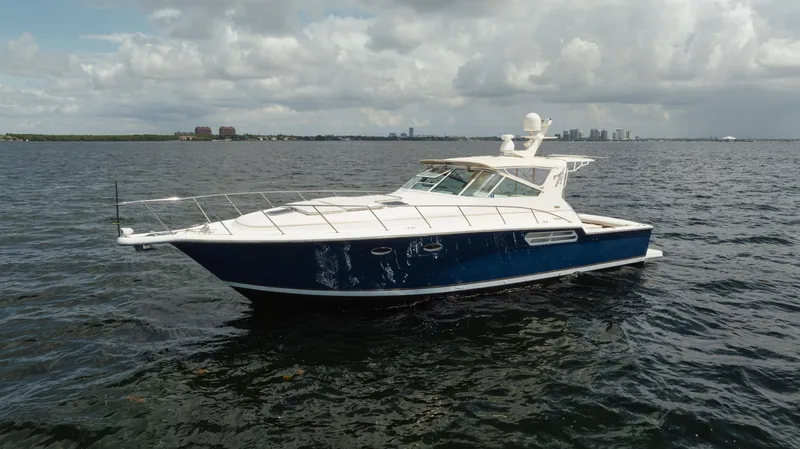 Yacht Photos Pics 1998 Tiara Yachts 4300 Open cruising on a calm sea under cloudy skies.
