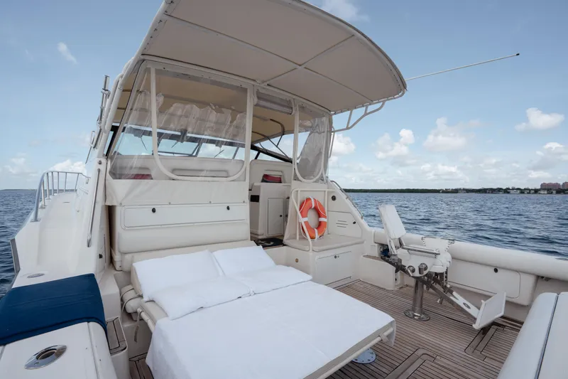  Yacht Photos Pics 1998 Tiara Yachts 4300 Open with spacious deck and seating, cruising on open water.