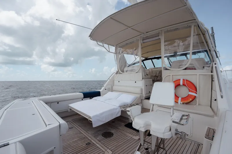  Yacht Photos Pics 1998 Tiara Yachts 4300 Open deck with seating, life preserver, and ocean view.