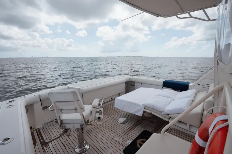  Yacht Photos Pics 1998 Tiara Yachts 4300 Open deck with seating, ocean view, and cloudy sky.