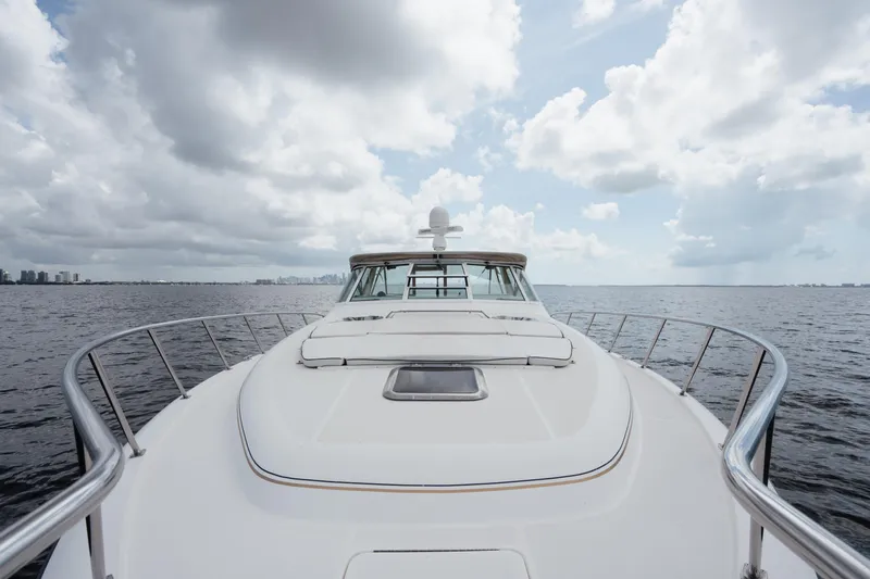  Yacht Photos Pics 1998 Tiara Yachts 4300 Open cruising on open water under cloudy skies.